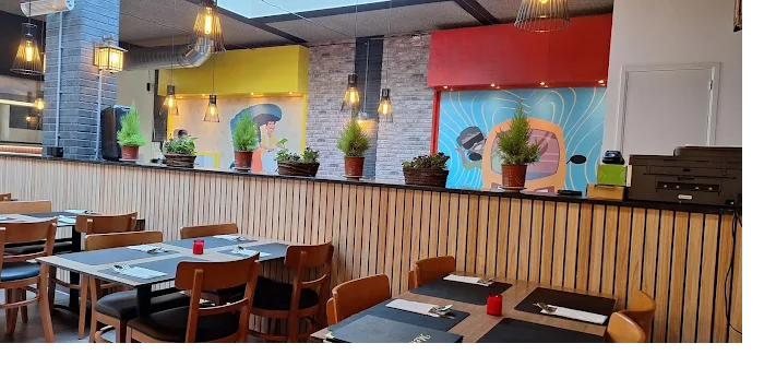 Our dining room, with tables set under the murals